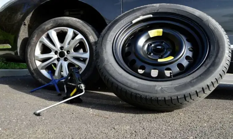 you should lower the car to the point where the full weight is on the spare tire.